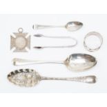 A collection of silver items including: George III Hanovarian Berry spoon, Thomas & William Chawner,