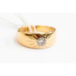 An 18ct gold and diamond set dress ring, comprising a central set diamond approx 0.