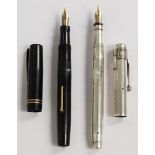 A pair of Swan fountain pens, one black body pre 1950's and one 1930's in hallmarked silver.