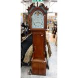 An 1874 Moonroller long case clock, the case oak with Romanesque mouldings,