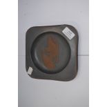 A 20th Century art-deco style raised pewter dish,