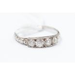 An Art Deco diamond set platinum ring, comprising four stones set to the top, size K,