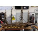 A pair of model boats, 'Bluenose' and 'Bellona', both on stands,