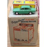 A boxed Triumph 2000 The Lucky Toys car, complete with suitcases and roof rack,