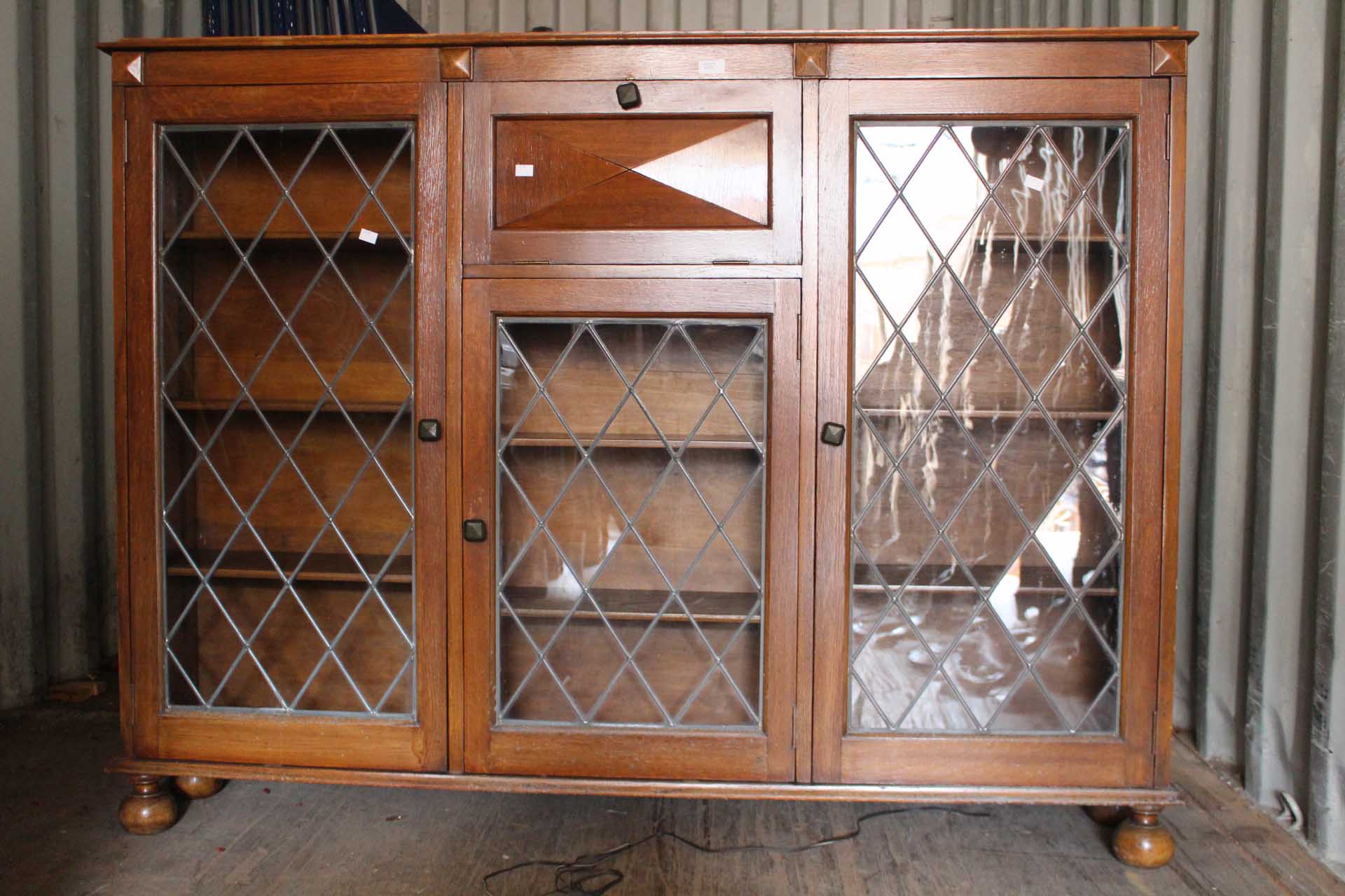 A 20th Century Oak Glazed Bookcase, Fall Front Cupboard with leather interior writing slope.