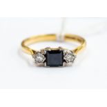 An 18ct gold diamond and square-cut sapphire ring, platinum settings, size O½,