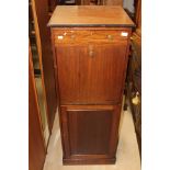 An Early 20th Century Mahogany Fallfront cupboard, three tier shelves in lower cupboard.