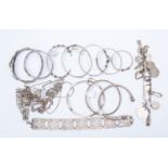 A collection of fourteen silver bracelets, one set with amethyst, to include: gate, charm,