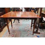 A mahogany drop leaf table