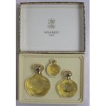 A Nina Ricci of Paris perfume set, L'Air Du Temps comprising three bottles, designed by Lalique,