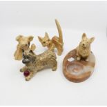A Beswick cairn terrier and three Sylvac dogs,