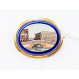 A late Victorian/early Edwardian micro mosaic brooch, oval depicting Venetian bridge,