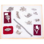 Twelve brooches, one necklace and one bracelet,