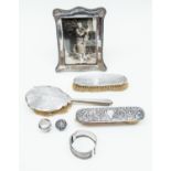 Silver backed hair/clothes brushes, bangle, walking cane tops, photo frame,