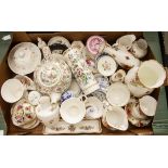 A collection of assorted decorative porcelain tea and table wares including vases, cups and saucers,