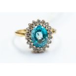 An 18ct gold blue zircon and diamond cluster ring, ring size I, total gross weight approx 4gms,