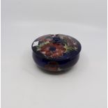 Moorcroft dish and cover, blue ground, Anemone design, 13 cms wide,
