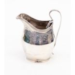 A George III silver helmet shaped bright-cut engraved cream jug with reeded C-scroll handle, Peter,