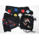 Four shawls to include a black embroidered shawl,