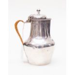 An Edwardian silver cream jug, makers mark rubbed, assayed London 1901, of circular baluster form,