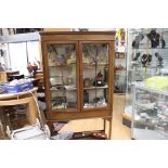An Edwardian Mahogany Display Cabinet on Long Squared Tapered Support