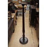 A large Torchere,