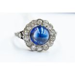 A vintage diamond and sapphire ring comprising a cabochon sapphire ring,