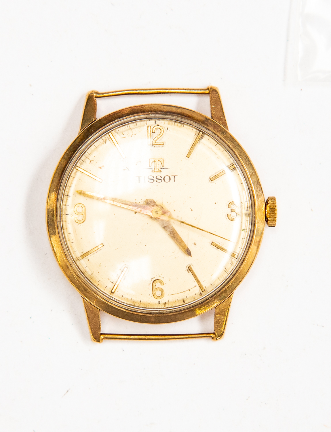 A 9ct gold Tissot watch face, batons, champagne tone dial, dial diameter approx 27mm,