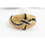 A sapphire and diamond boule head ring,