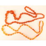 Two faceted amber bead necklaces,