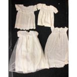 Collection of baby clothes including Christening dresses