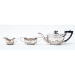 A bachelors silver tea set comprising of teapot, sugar bowl and cream jug,