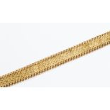 A fancy link 9ct gold bracelet, chain edge detail, weight approx. 28gms.