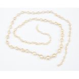 A pearl necklace comprising graduated alternate round pearl with seed pearl spacers a/f,