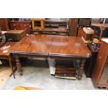 A reproduction Victorian style oak dining table and ten chairs,