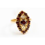 An 18ct gold garnet ring, lozenge shape, size N, gross weight approx 4.