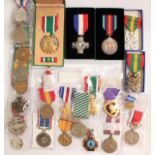 A collection of International medals to include USA Purple Heart, British, Russian etc.