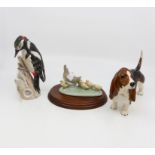 Various figurines to include; Beswick Bassett Hound, Goebel Great Spotted Woodpecker,