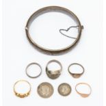 An 18ct gold ring, 1.9gms (af); a 9ct gold ring, 1.1gms; a silver bangle, Chester 1890, 19.