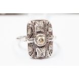 An Art Deco platinum rectangular diamond ring, pierced settings,