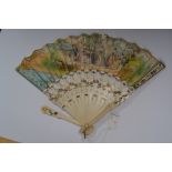 An 18th Century hand-painted and ivory fan, the sticks and guards pierced and gilded,