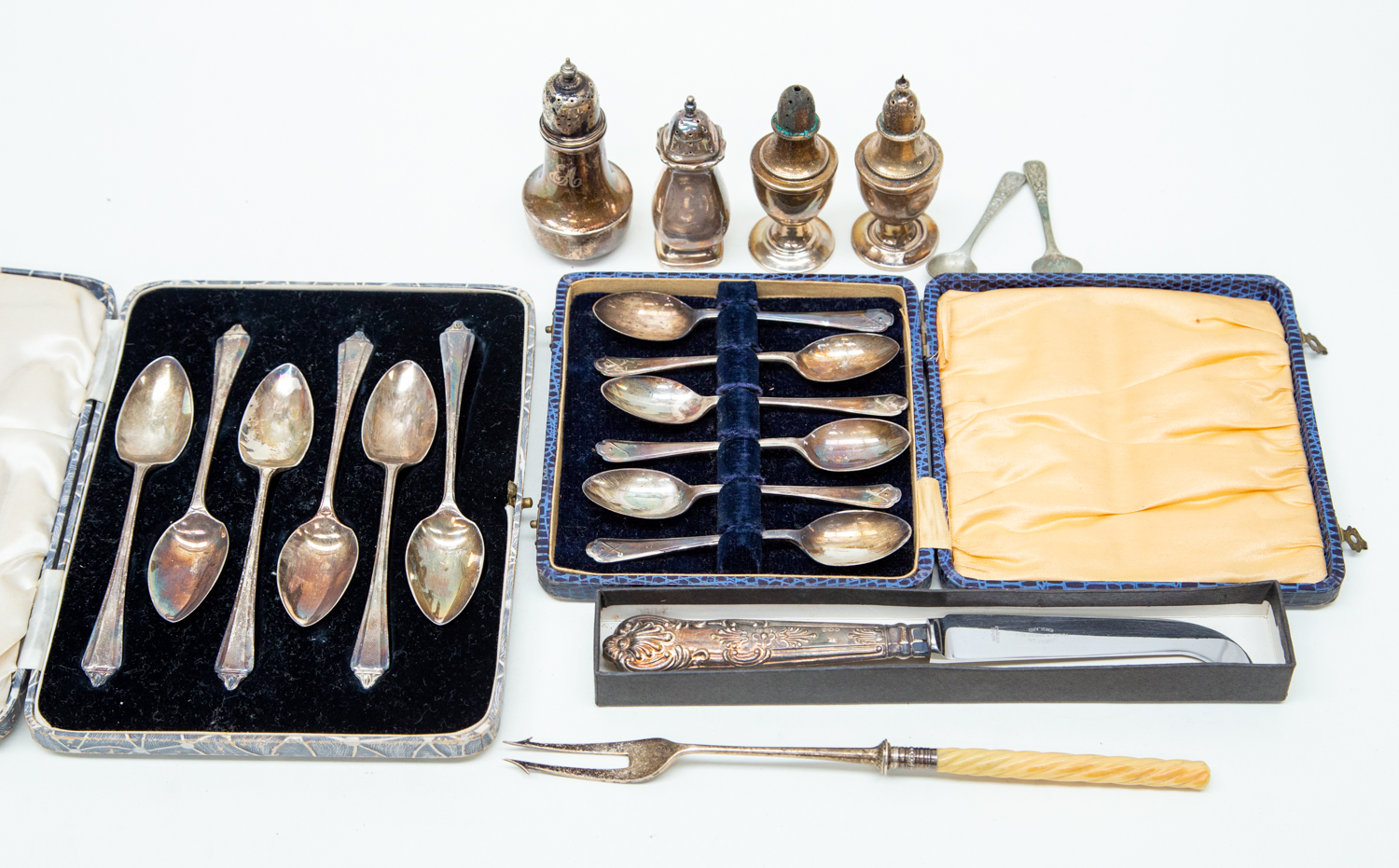 Collection of cased silver fruit spoons,