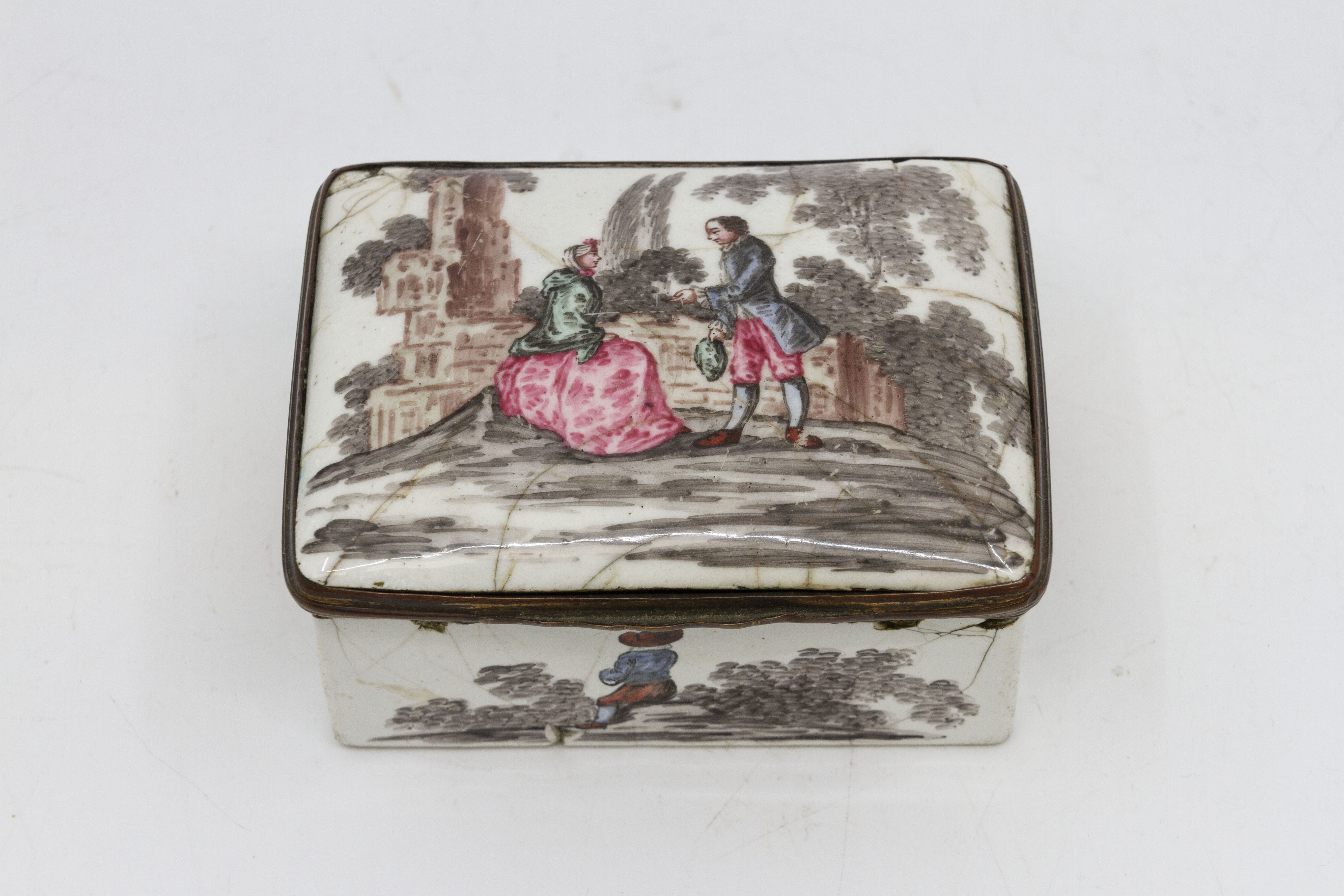 An 18th Century enamel snuff box, probably continental, the cover with a courting couple,