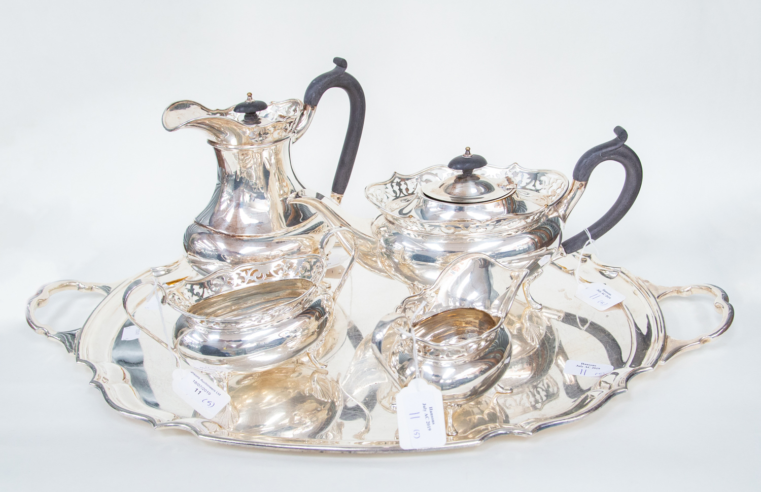 An EPNS A1 tea set by "R Roe & Co Ltd" comprising of a tray (50cm across) Tea Pot, Water jug,