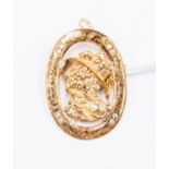 A 9ct gold and diamond set brooch, oval brooch with central cut out detail of a lady,