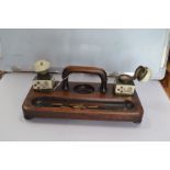 A 19th Century desk/pen stand with two painted ceramic inkwells and hinged caps (one containing