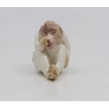 A Royal Worcester netsuke modelled as an Ape, green stamp, dated circa 1913,