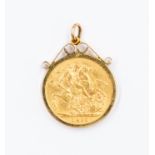 A 1911 Sovereign, mounted in 9ct gold.