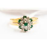 An emerald and diamond cluster 18ct gold ring, size Q, gross weight approx 4.