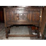 An Early 20th Century Carved Oak Cabinet